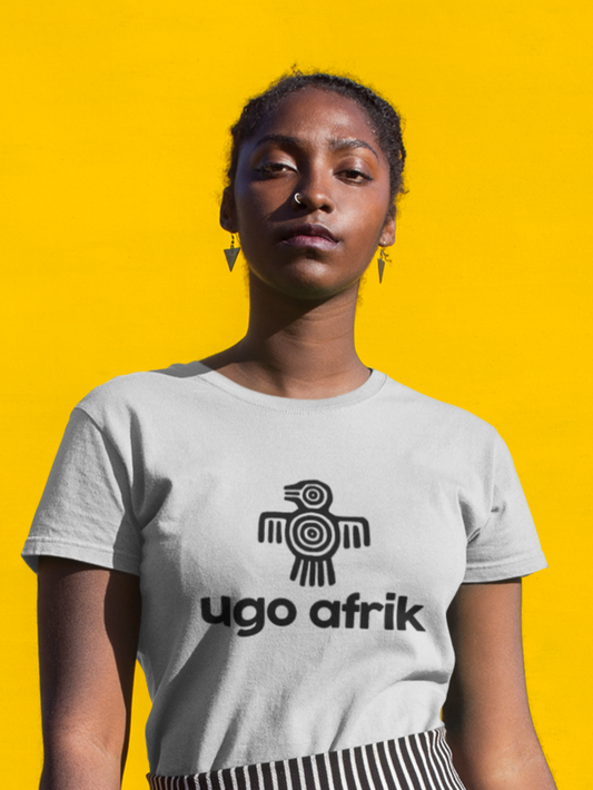 Person wearing a white t-shirt with 'ugo afrik' logo on a yellow background