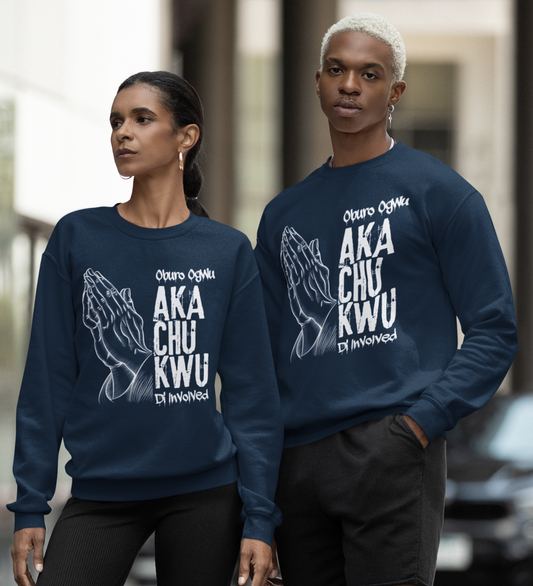 Two people wearing matching navy blue sweatshirts with white text on a city street.