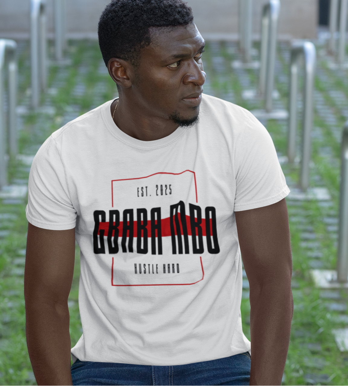 Man wearing a white t-shirt with text in an outdoor setting