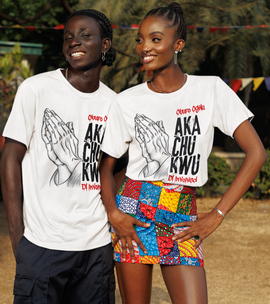 Two people wearing matching t-shirts with text, standing outdoors.