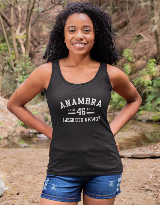 Woman wearing a black tank top with 'ANAMBRA' text in a forest setting
